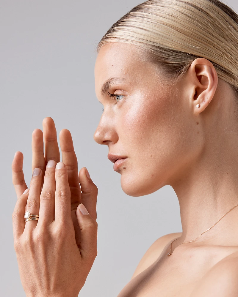 0.25 Carat TW Round Brilliant Diamond Solitaire Bezel Set Stud Earrings in 18kt Yellow Gold