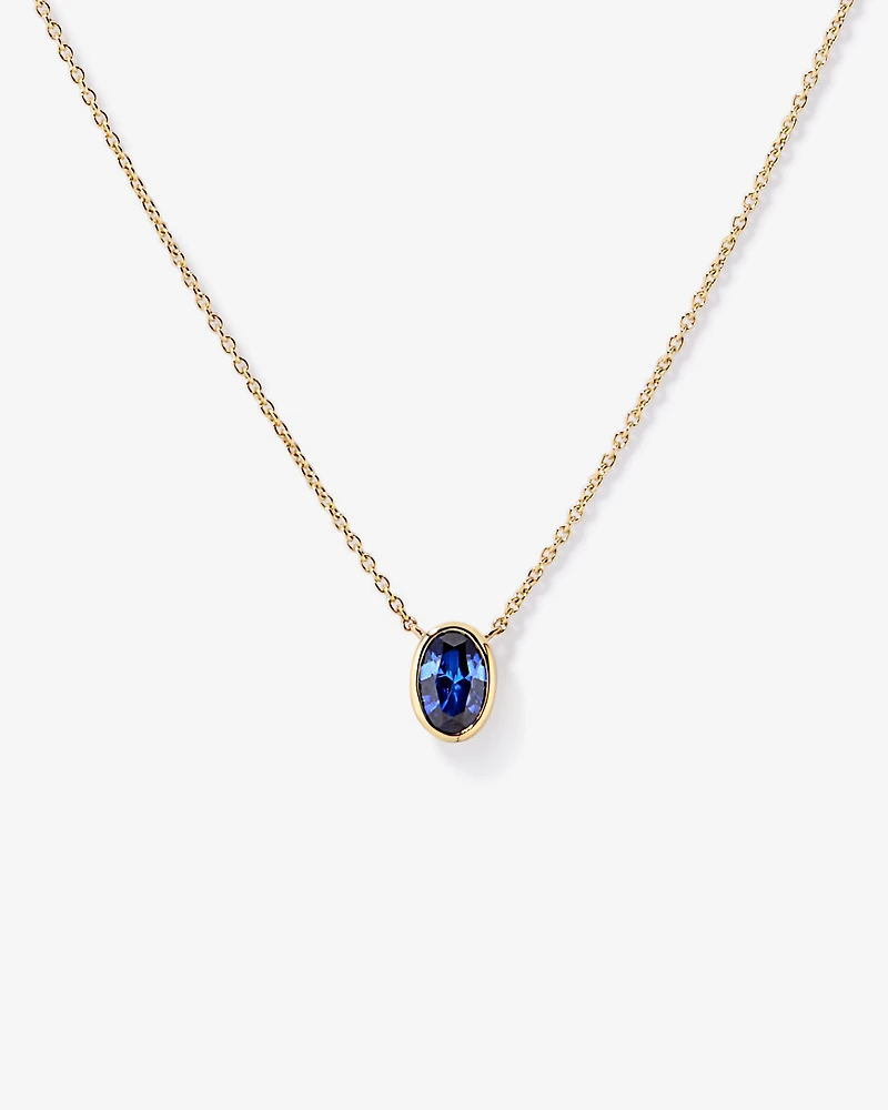 Oval Blue Created Sapphire Bezel Necklace in 10kt Gold