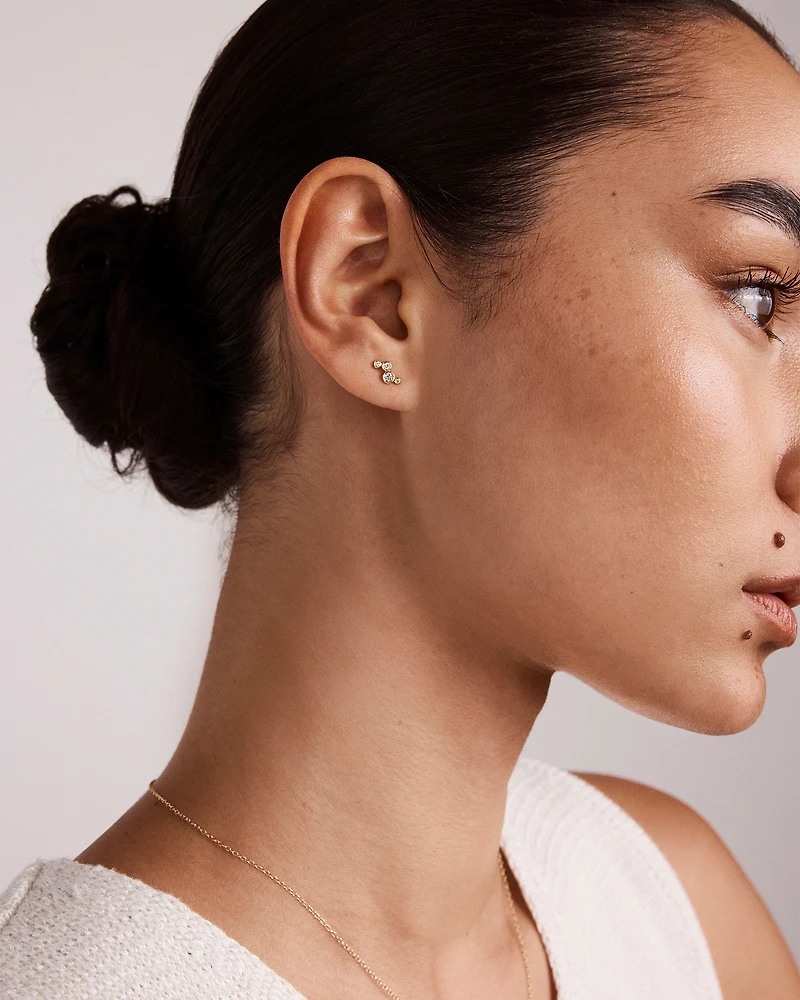 0.15 Carat TW Round Brilliant Graduated Diamond Bezel Set Stud Earrings in 10kt Yellow Gold