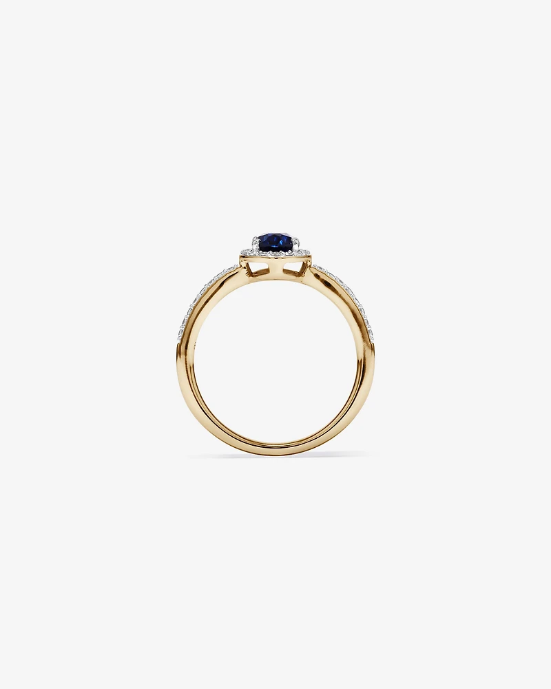 Oval Cut Blue Created Sapphire and Lab-Grown Diamond Halo Ring in 10kt Yellow Gold and Rhodium