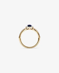 Oval Cut Blue Created Sapphire and Lab-Grown Diamond Halo Ring in 10kt Yellow Gold and Rhodium