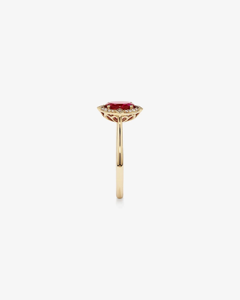 Oval Cut Created Ruby and Diamond Halo Ring in 10kt Yellow Gold