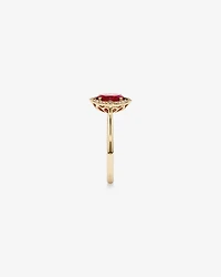 Oval Cut Created Ruby and Diamond Halo Ring in 10kt Yellow Gold