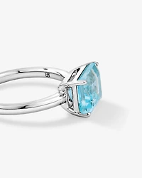 Bague taillée émeraude en topaze bleu ciel sertie d’est argent sterling