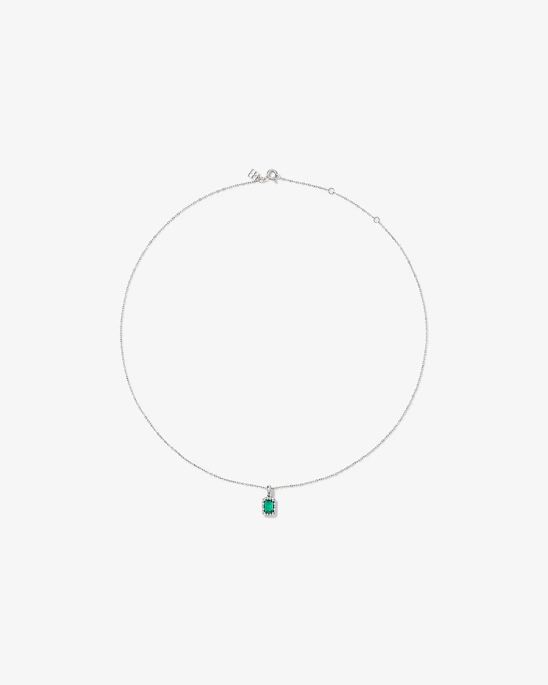 Created Emerald & 0.10 Carat TW Laboratory-Grown Diamond Halo Ring in 10kt Yellow Gold and Rhodium