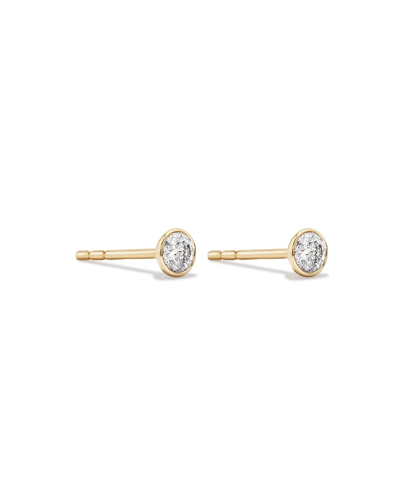 0.25 Carat TW Round Brilliant Diamond Solitaire Bezel Set Stud Earrings in 18kt Yellow Gold