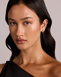 0.40 Carat TW of Laboratory-Grown Emerald Cut Diamond Huggie Earrings in 10kt Yellow Gold