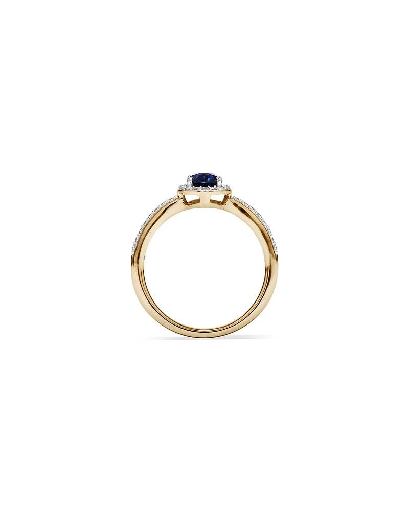 Oval Cut Blue Created Sapphire and Lab-Grown Diamond Halo Ring in 10kt Yellow Gold and Rhodium