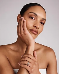 0.30 Carat TW Oval Shaped Cluster Halo Diamond Ring in 10kt Yellow Gold