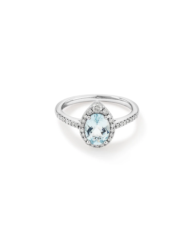 Oval Cut Blue Aquamarine Gemstone and 0.29 Carat TW Diamond Halo Ring in 10kt White Gold