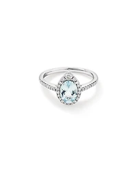 Oval Cut Blue Aquamarine Gemstone and 0.29 Carat TW Diamond Halo Ring in 10kt White Gold