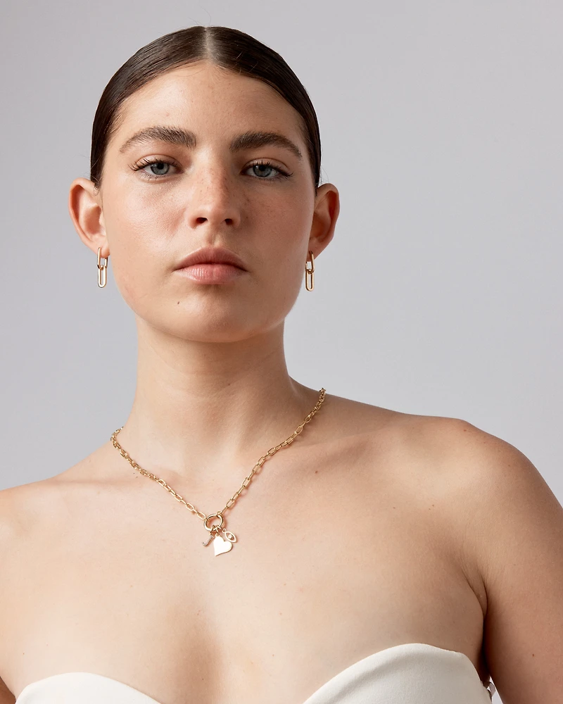 Boucles d'oreilles pendantes Huggie en forme de trombone en or jaune 10 kt