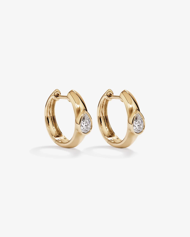 0.50 Carat TW of Laboratory-Grown Pear Cut Diamond Huggie Earrings in 10kt Yellow Gold