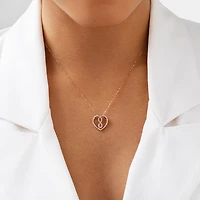 Petit pendentif Infinitas en or rose 10 K à diamants totalisant 0,25 ct