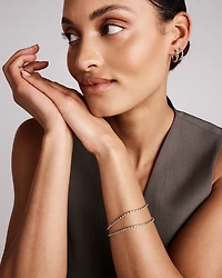 Bracelet tennis en or jaune 10 kt avec diamants de 0,68 carat TW et émeraudes créées