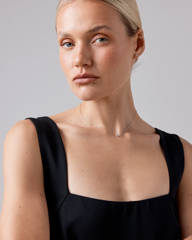 0.25 Carat TW Round Brilliant Diamond Solitaire Bezel Set Stud Earrings 18kt White Gold