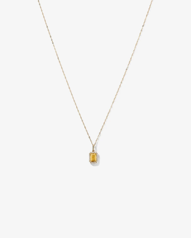 Pendentif avec chaîne en or jaune 10 carats : citrine taille émeraude et halo de diamants