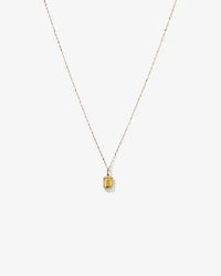 Pendentif avec chaîne en or jaune 10 carats : citrine taille émeraude et halo de diamants