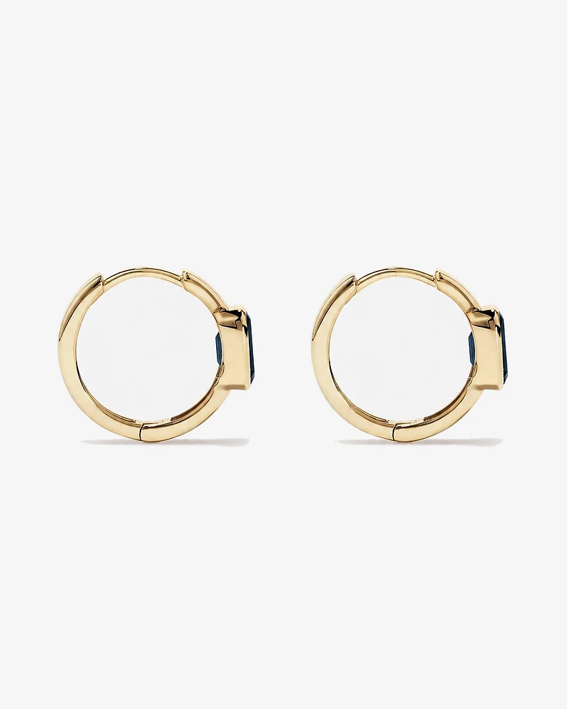 Boucles d'oreilles anneaux Topaze bleu London serties clos en or jaune 10 ct