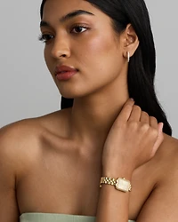 Women's 0.20 Carat TW Diamond Bezel Watch in Gold Tone Stainless Steel