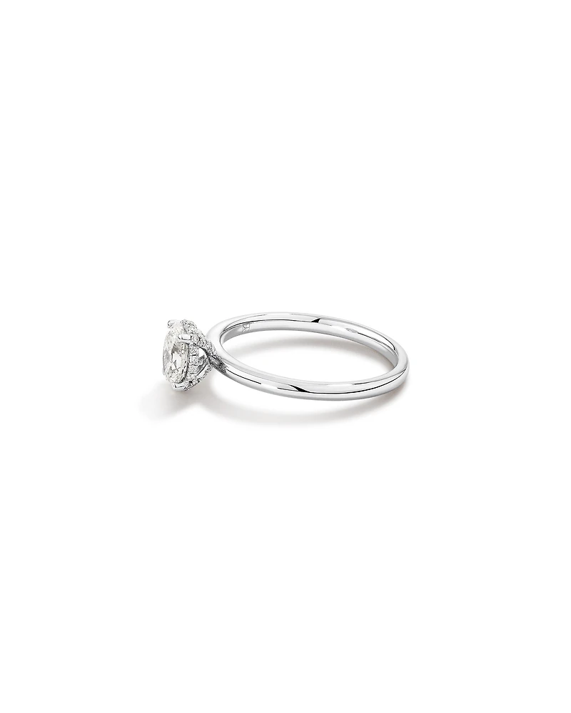 0.68 Carat TW Oval Cut Diamond Solitaire Hidden Pave Halo Engagement Ring in Platinum