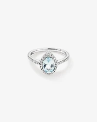 Oval Cut Blue Aquamarine Gemstone and 0.29 Carat TW Diamond Halo Ring in 10kt White Gold