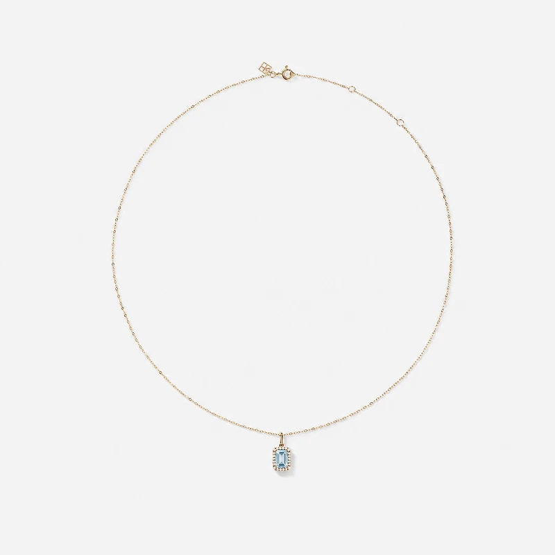 Emerald Cut Blue Topaz and Diamond Halo Pendant with Chain in 10kt Yellow Gold