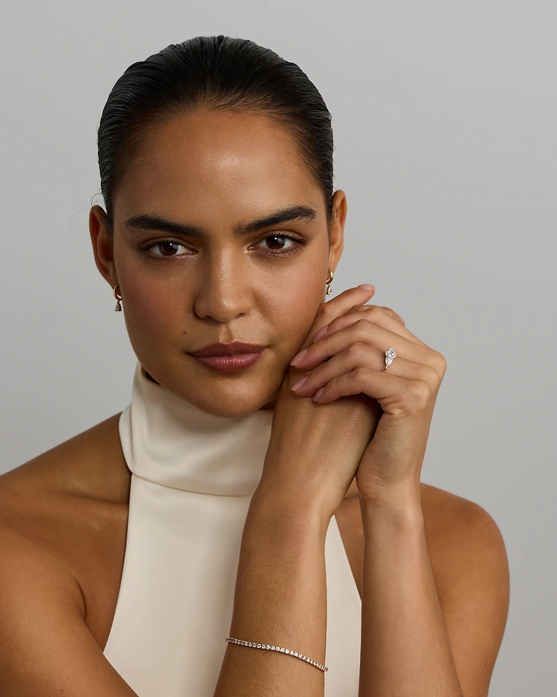 0.69 Carat TW Three Stone Oval and Pear Cut Diamond Halo Engagement Ring 14kt Yellow White Gold