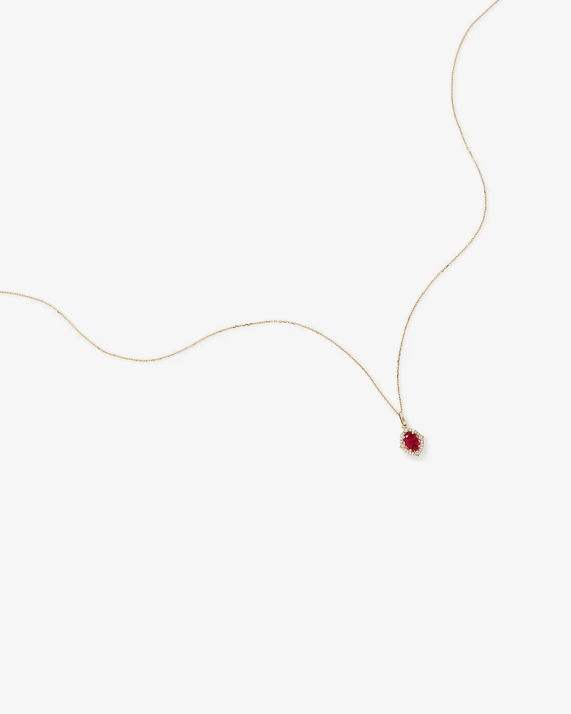 Oval Cut Created Ruby and Diamond Halo Pendant Necklace in 10kt Yellow Gold