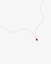 Oval Cut Created Ruby and Diamond Halo Pendant Necklace in 10kt Yellow Gold