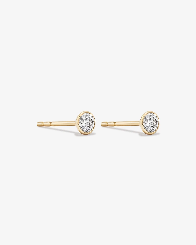 0.25 Carat TW Round Brilliant Diamond Solitaire Bezel Set Stud Earrings in 18kt Yellow Gold