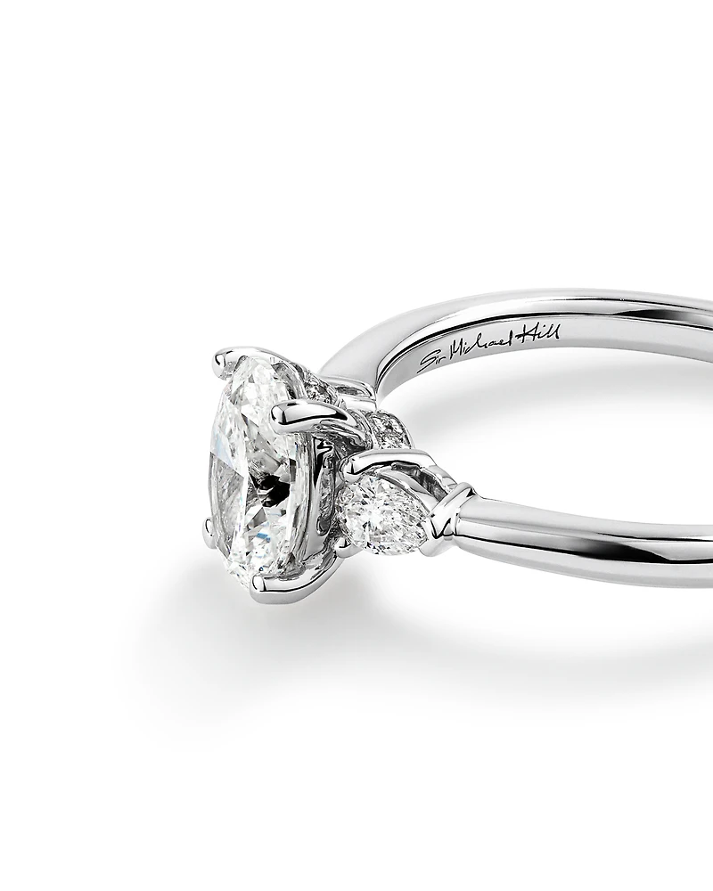 1.10 Carat TW Oval & Pear Cut Three Stone Engagement Ring in 18kt White Gold