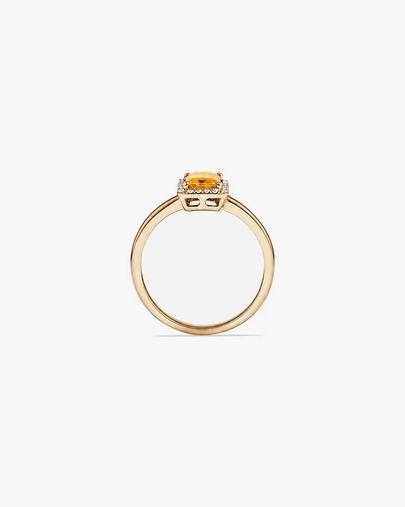 Bague en or jaune 10 carats avec citrine taille émeraude et halo de diamants