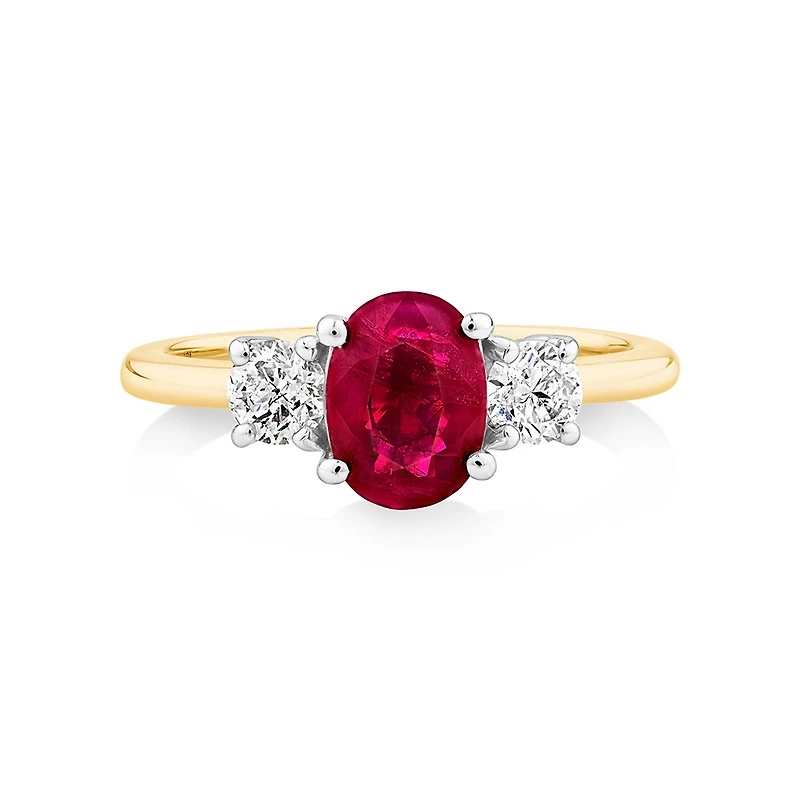 Bague en or blanc et jaune 14 K avec rubis et diamants totalisant 0,40 ct