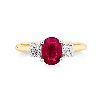 Bague en or blanc et jaune 14 K avec rubis et diamants totalisant 0,40 ct
