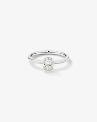 0.68 Carat TW Oval Cut Diamond Solitaire Hidden Pave Halo Engagement Ring in Platinum