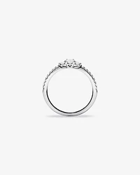 0.40 Carat TW Oval and Round Brilliant Three Stone Side Accent Engagement Ring in 14kt White Gold