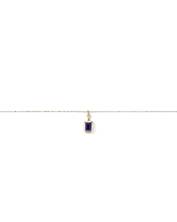 Emerald Cut Created Sapphire Bezel Pendant with Chain in 10kt Yellow Gold