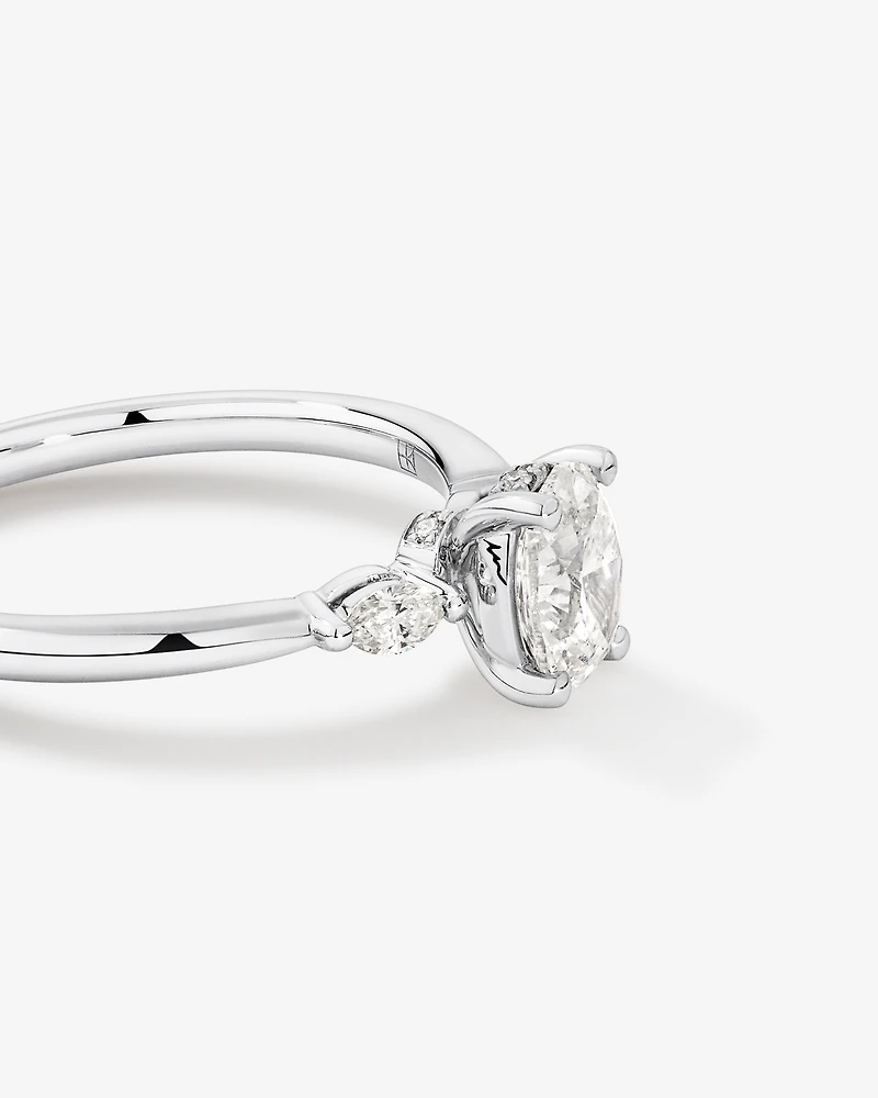 0.77 Carat TW Three Stone Oval and Marquise Cut Hidden Halo Engagement Ring in Platinum