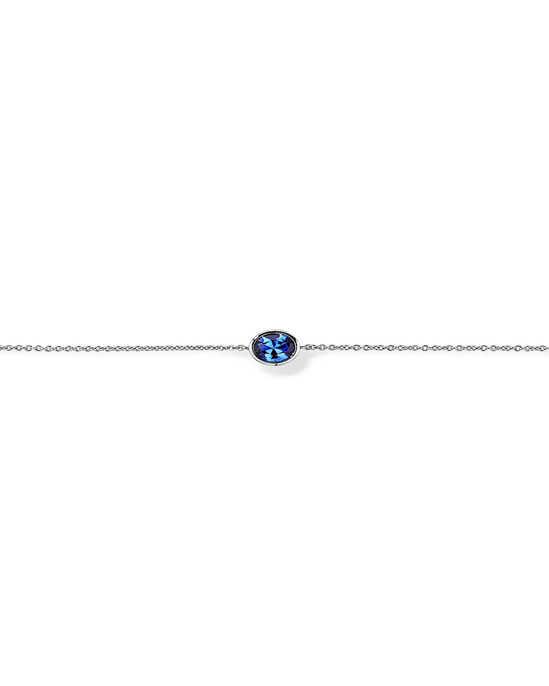 Oval Blue Created Sapphire Bezel Bracelet in 10kt White Gold