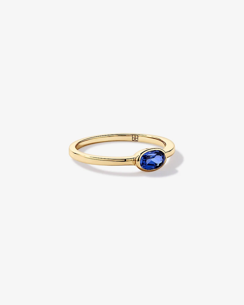 Oval Blue Created Sapphire East-to-West Set Bezel Ring 10kt Gold