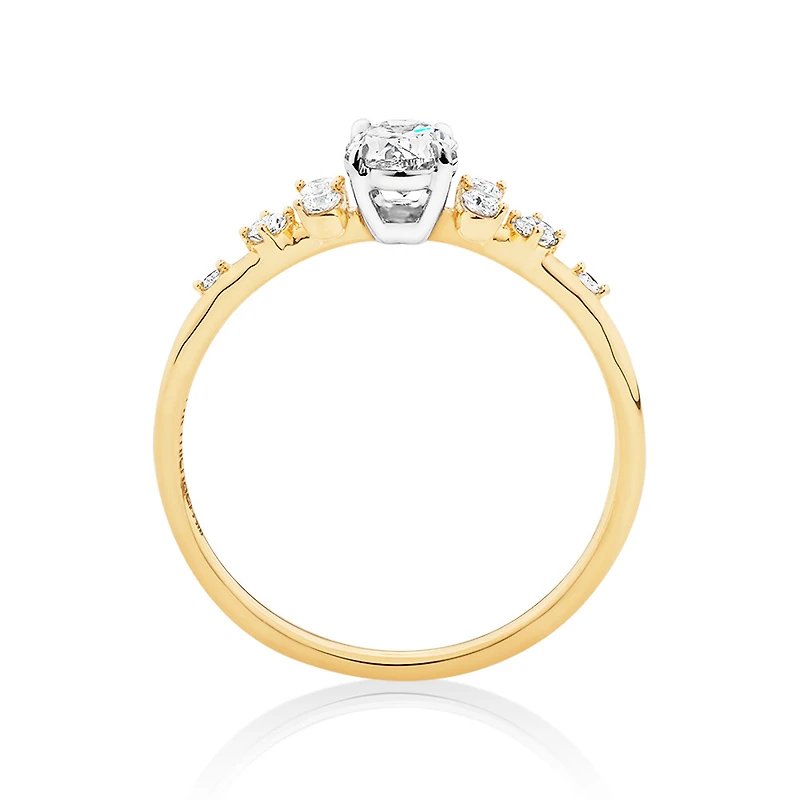 Bague à halo ovale en or blanc et jaune 14 K à diamants dispersés totalisant 0,63 ct