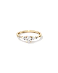 0.59 Carat TW Oval and Pear Sidestone Engagement Ring in 14kt Yellow Gold