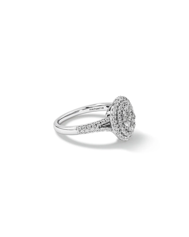 0.65 Carat TW Oval Shaped Cluster Halo Diamond Ring in 10kt White Gold