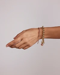 0.68 Carat TW Diamond and Created Ruby Tennis Bracelet in 10kt Yellow Gold