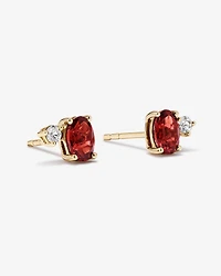 Round White Sapphire and Oval-Cut Garnet Toi Et Moi Stud Earrings in 10kt Yellow Gold