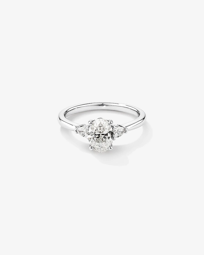 1.10 Carat TW Oval & Pear Cut Three Stone Engagement Ring in 18kt White Gold