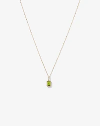 Pendentif halo Péridot taille émeraude avec diamants et chaîne en or jaune 10 ct
