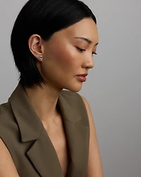 Boucles D'Oreilles Halo Avec Pierre Précieuse Aigue-Marine Bleue Taille Ovale Et 0,27 Carat Pt De Diamants En Or Blanc 10 Ct