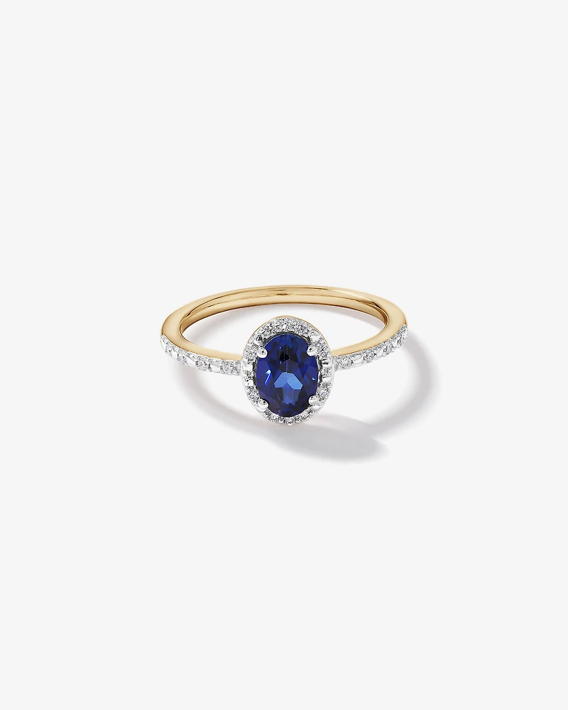 Oval Cut Blue Created Sapphire and Lab-Grown Diamond Halo Ring in 10kt Yellow Gold and Rhodium